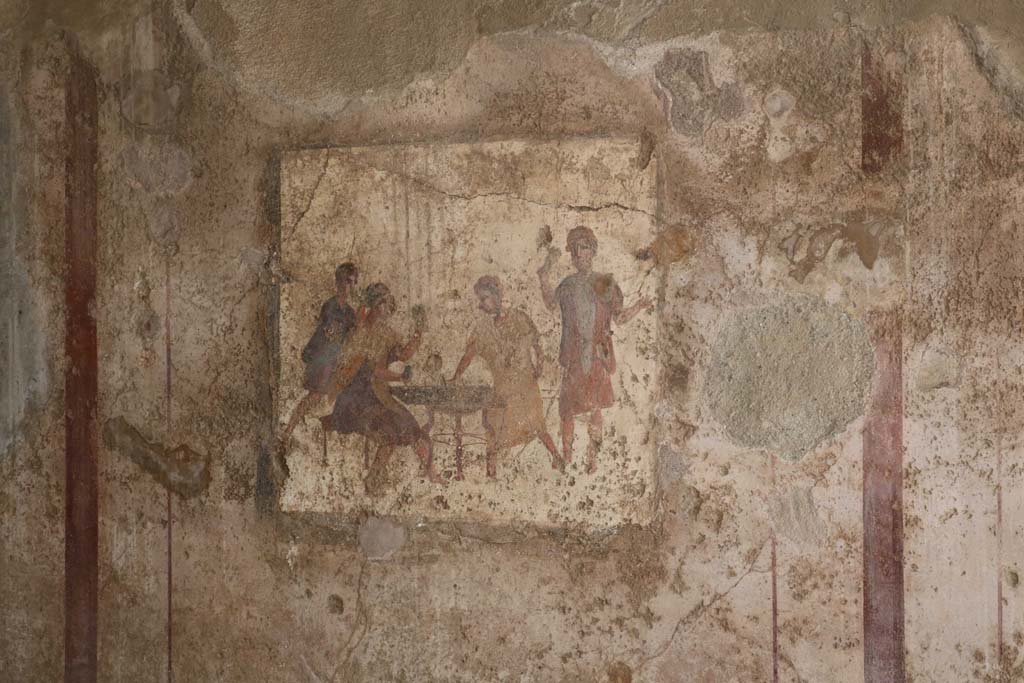 VI.10.1 Pompeii. December 2018.
Fresco from east end of south wall of rear room, showing men gambling. Photo courtesy of Aude Durand.