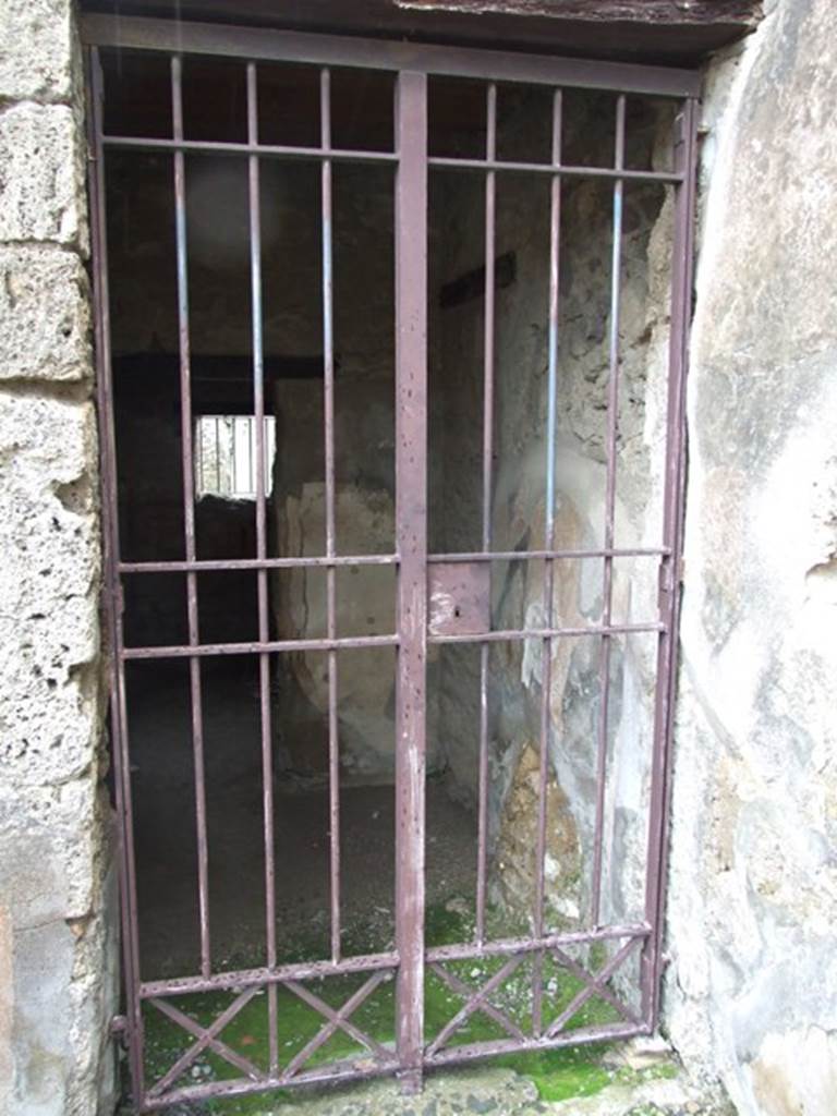 VI.10.1 Pompeii. March 2009. Doorway to two rooms on south side of east wall of bar-room.
According to Boyce, on the south wall beneath the stairs was a lararium painting:
A single serpent about to devour the offerings – an egg and a pine cone – on a burning altar.
See Boyce G. K., 1937. Corpus of the Lararia of Pompeii. Rome: MAAR 14. (p.50, no.180).
(Note: in Part 1 of VI.10.1, the lararium painting can be seen (courtesy of William Gell) against the west wall.)
According to Eschebach, near the stairs was the doorway into the two rooms on the south side.
See Eschebach, L., 1993. Gebäudeverzeichnis und Stadtplan der antiken Stadt Pompeji. Köln: Böhlau. (p.192)