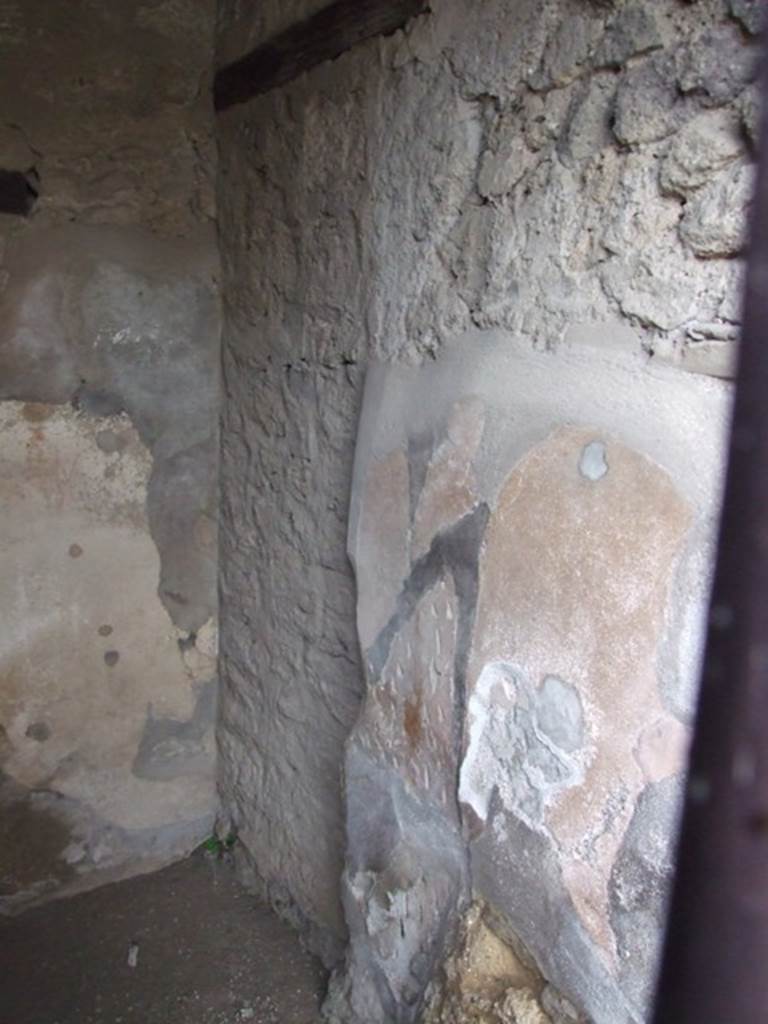VI.10.1 Pompeii. March 2009. South-east corner, with blocked doorway in VI.10.2, and south wall of front room on south side of bar-room.