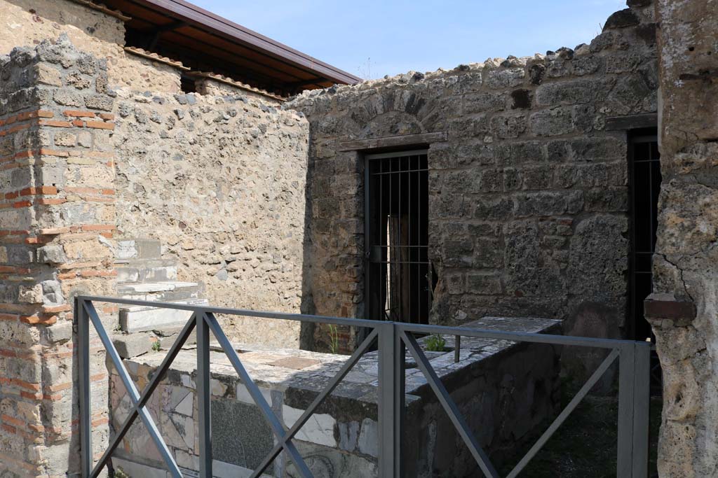 VI.10.1 Pompeii. December 2018.
Looking north-east across counter in bar-room towards doorway to rear room. Photo courtesy of Aude Durand.