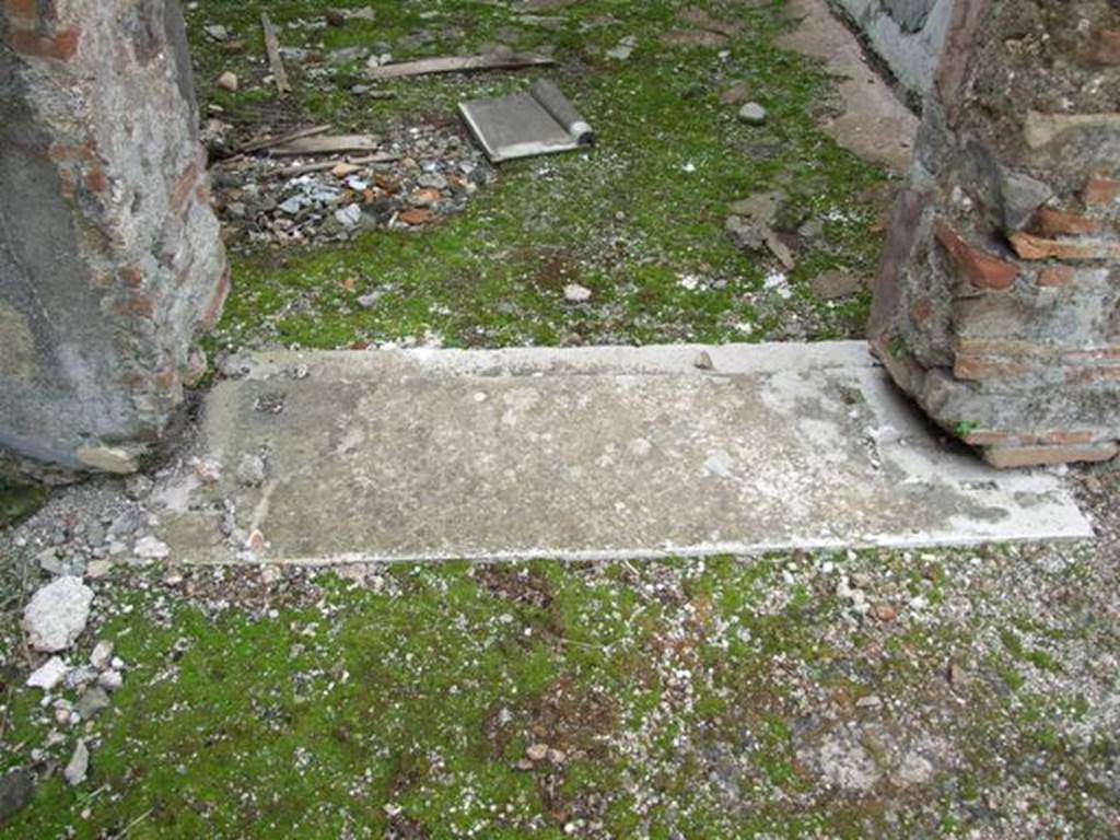 VI.10.7 Pompeii. March 2009. Room 2. Marble door sill.