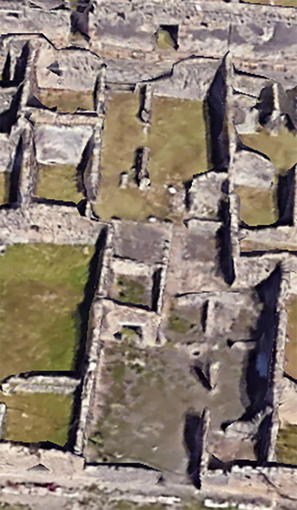 VI.11.4/17 Pompeii. Google Earth. 2023.
Looking east from VI.11.4 entrance doorway into workshop, lower centre.