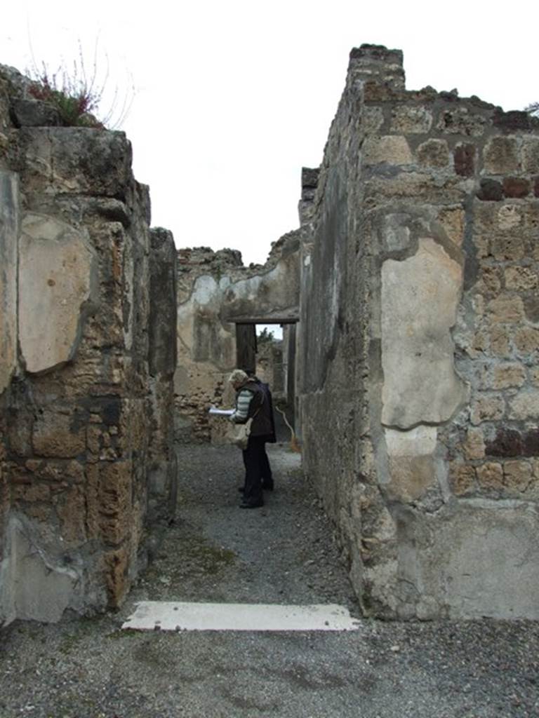 VI.11.9 Pompeii. March 2009.
Doorway to, corridor 15 on north side of atrium leading to services, baths and bakery area.