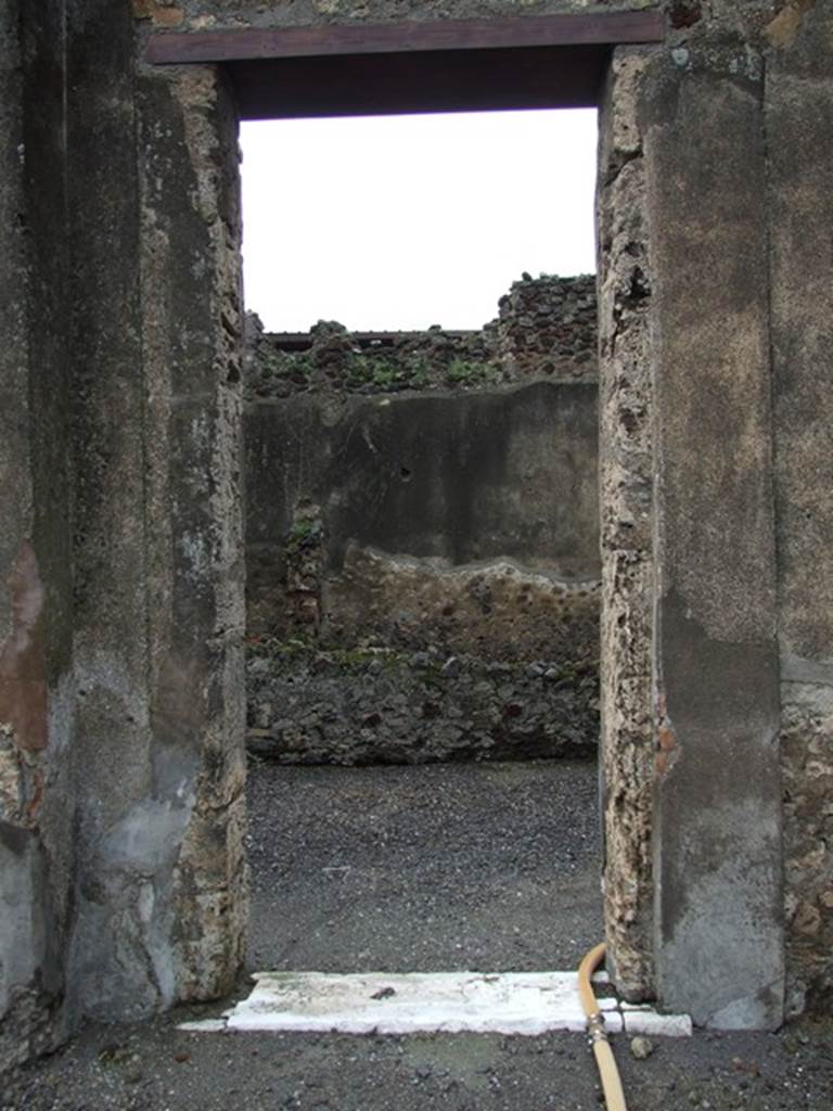 VI.11.9 Pompeii. December 2006.
Doorway from west side of peristyle 36 of VI.11.10 into long corridor room, looking west.
