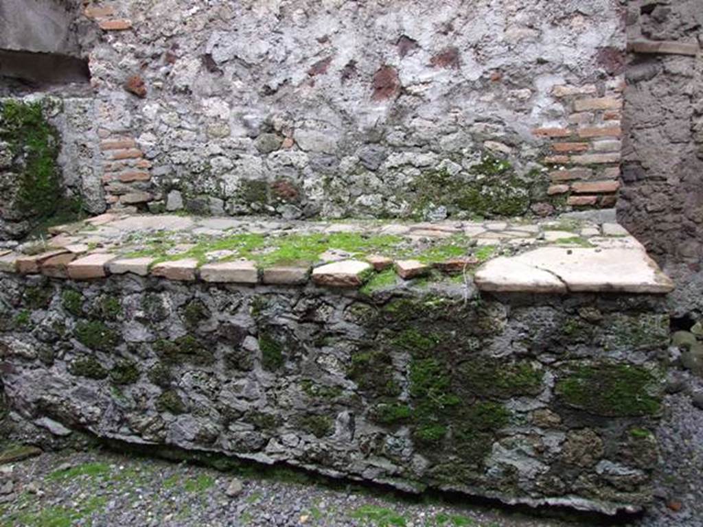 VI.11.9 Pompeii. March 2009. Room 13, bench or hearth in kitchen.