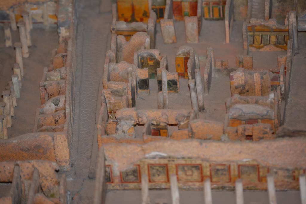 VI.11.9/10 Pompeii. July 2017. Top right, below the stairs, looking towards west wall of room 38, with window into room 35.
Beneath the window, the west wall of tablinum 33 can be seen.
Across the centre, the west side of atrium 27 features the black painted room 28, the yellow/red painted room 29, undecorated corridor 48, and room 31, west ala.
From cork model in Naples Archaeological Museum.
Foto Annette Haug, ERC Grant 681269 DÉCOR.