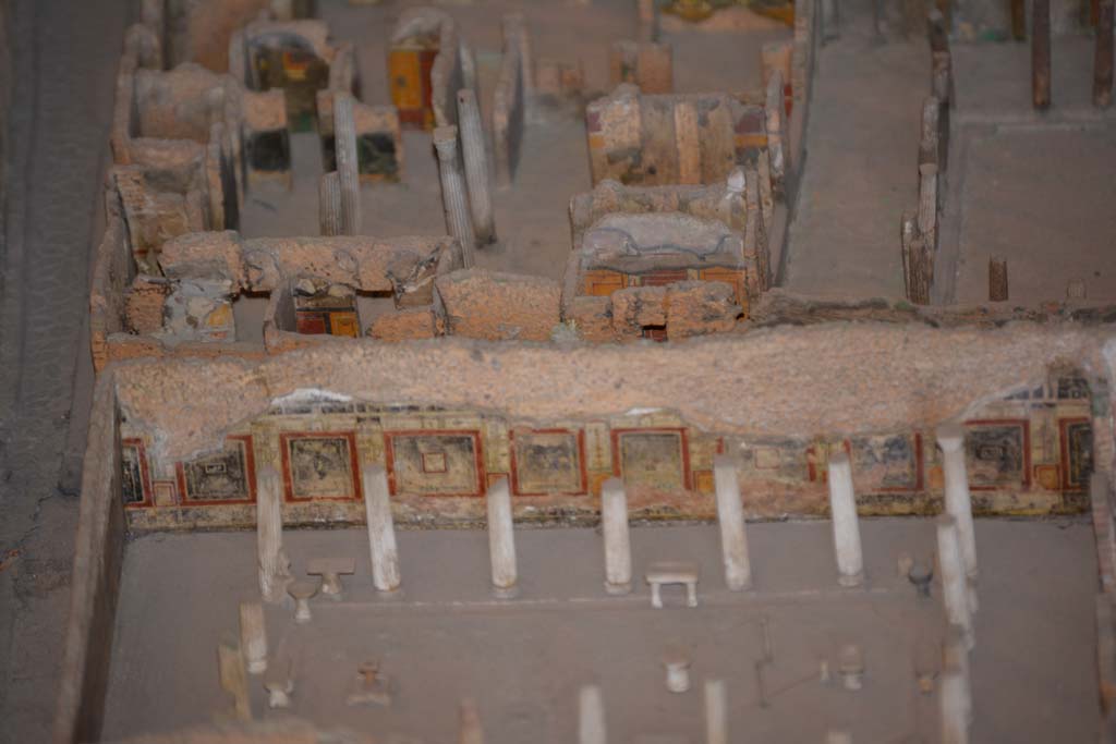 VI.11.9/10 Pompeii. July 2017. Looking west.
Across the centre, on the east side of atrium 27, the west wall of rooms 26, and the red/black west wall of room 30 can be seen.
From cork model in Naples Archaeological Museum.
The lower west wall and peristyle belong to VI.15.1, thr House of Vettii.
Foto Annette Haug, ERC Grant 681269 DÉCOR.