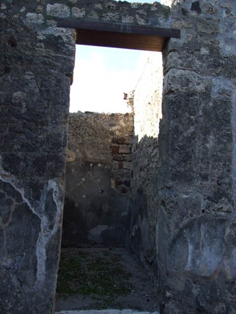 VI.11.10 Pompeii. December 2007.
Doorway to room 28, looking towards north-west corner and along north wall.