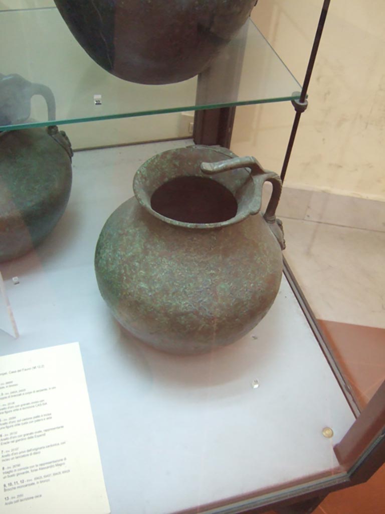 VI.12.2 Pompeii. Found on 5th November 1830. One handled bronze jug.
Now in Naples Archaeological Museum. Inventory number 69429.
See Fiorelli G., 1862. Pompeianarum antiquitatum historia, Vol. 2: 1819 - 1860, Naples, p. 242-243.