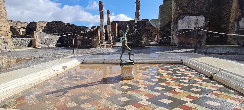 VI.12.2 Pompeii. April 2022.
Looking across impluvium in atrium towards east side, and through to atrium of VI.12.5. Photo courtesy of Giuseppe Ciaramella.