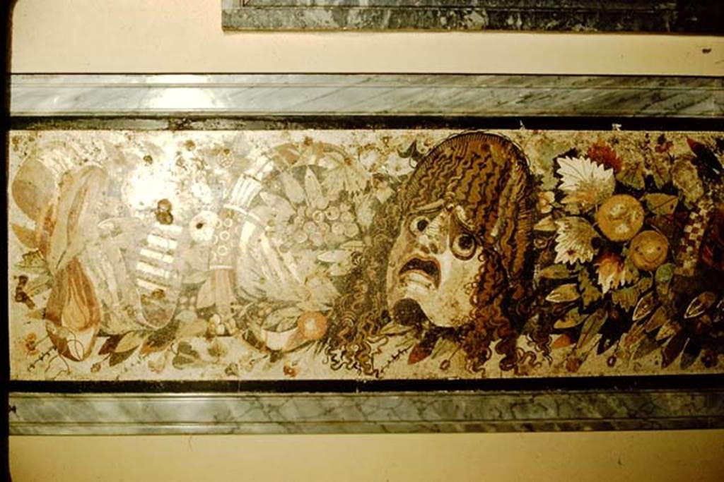 VI.12.2 Pompeii. 1957. Detail from mosaic of two tragic masks, with fruits, flowers and garlands. Photo by Stanley A. Jashemski.
Source: The Wilhelmina and Stanley A. Jashemski archive in the University of Maryland Library, Special Collections (See collection page) and made available under the Creative Commons Attribution-Non Commercial License v.4. See Licence and use details.
J57f0530