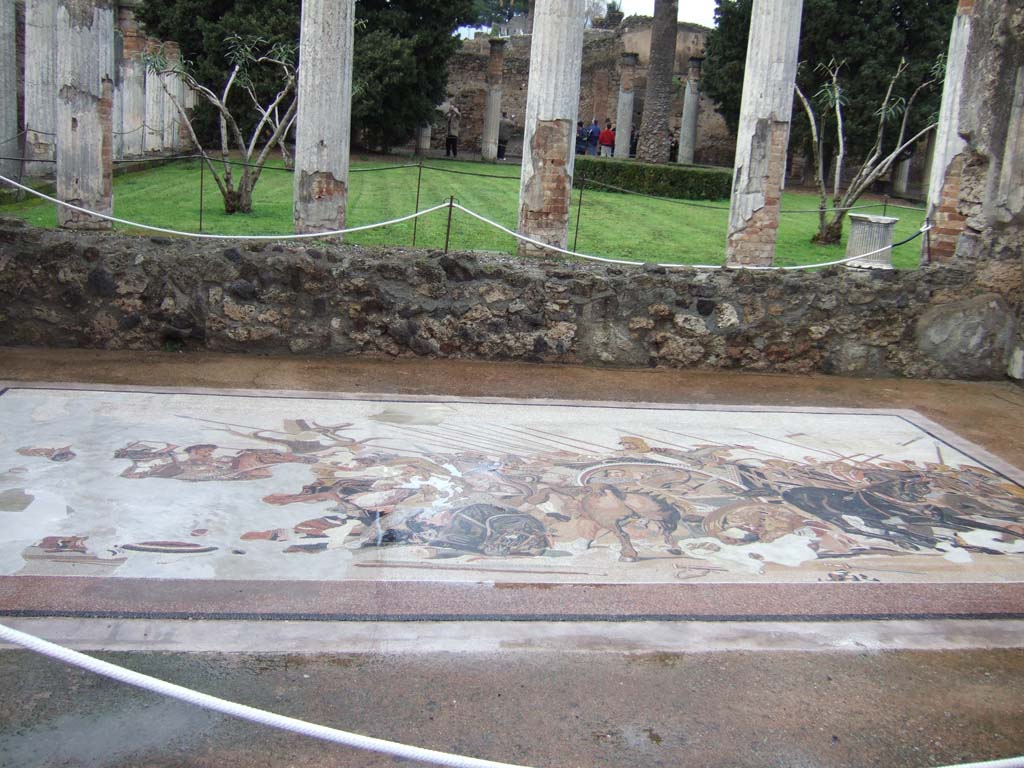 VI.12.2 Pompeii. December 2005. Looking north to rear peristyle across recreated Alexander mosaic in exedra.
