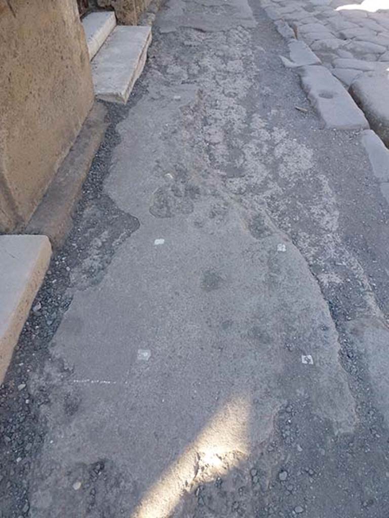 VI.12.5 Pompeii. June 2012.
Looking east along pavement outside VI.12.4 and VI.12.5 (top), on north side of Via della Fortuna.
Photo courtesy of Michael Binns.