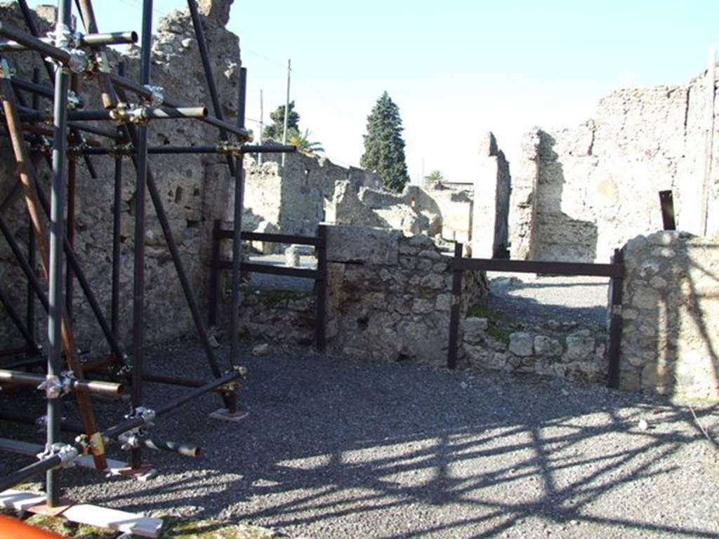 VI.13.3 Pompeii. December 2007. Looking towards north wall of shop.
Doorway on left led to the atrium of VI.13.2. Doorway on right led to a cubiculum of VI.13.2.
