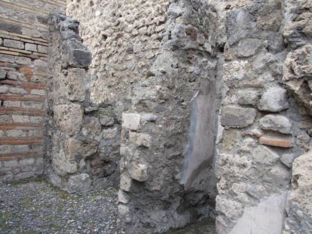 VI.13.11 Pompeii. Shop. December 2007. North wall with remains of staircase and latrine.