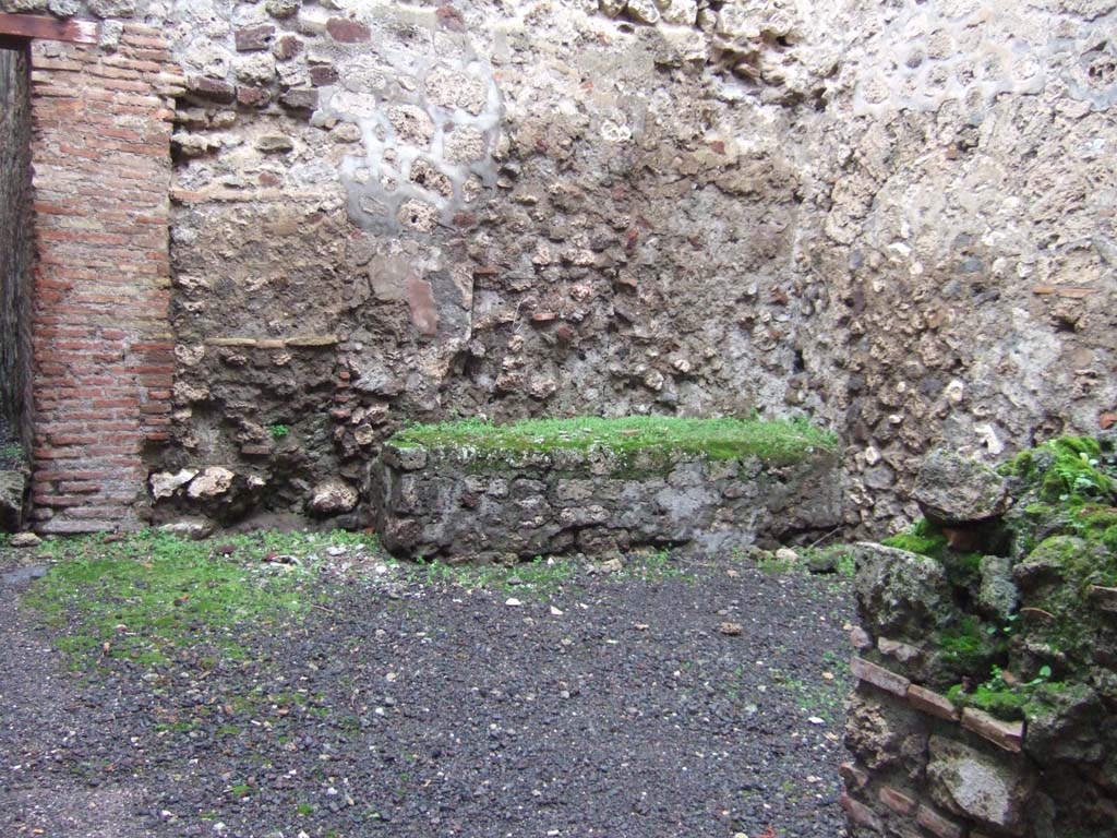 VI.13.12 Pompeii. December 2005.
Looking north-west across room formerly linked to kitchen area by means of the blocked doorway.