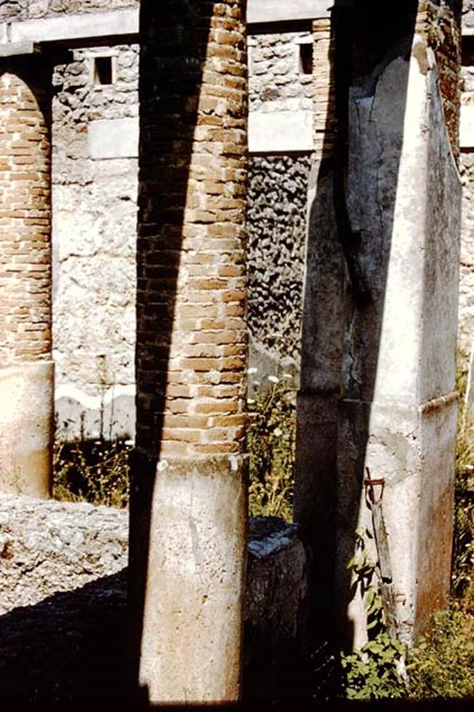 VI.14.22 Pompeii. 1959. Room 12, north-east corner of the rinsing basin/vat. According to Jashemski, originally the portico would have been supported by a heavy pillar on the north-east, north-west and south-west corners. There were also two columns on each of the three sides, the north, east and south sides.
See Jashemski, W. F., 1993. The Gardens of Pompeii, Volume II: Appendices. New York: Caratzas. (p.150)
Photo by Stanley A. Jashemski.
Source: The Wilhelmina and Stanley A. Jashemski archive in the University of Maryland Library, Special Collections (See collection page) and made available under the Creative Commons Attribution-Non Commercial License v.4. See Licence and use details.
J59f0423