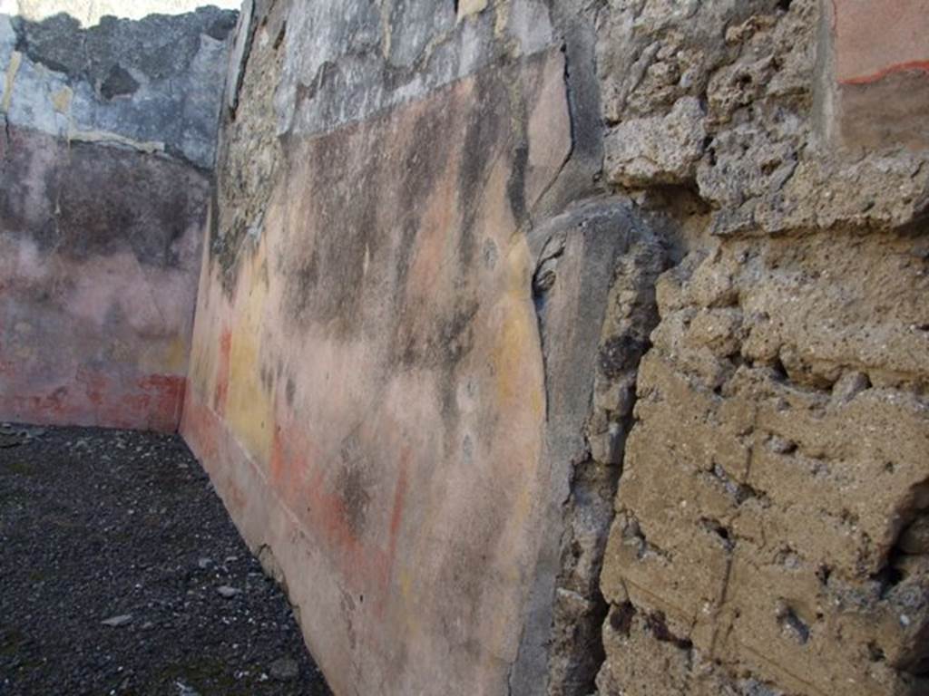 VI.14.22 Pompeii. December 2007. Room 15, south wall of triclinium. According to BdI, on this wall (the right wall) the following paintings were seen upon excavation:
In the middle of the right wall:(1.12 high x 1.12 wide) but very faded: Judgement of Paris.
On the same wall to the right: medallion (0.33 diam), preserved better than the others showing a crowned Bacchante, with blond hair.
To the right of the medallion: Flying cupid, carrying an object in his hand but this was not clear.
On the upper part of the wall was the usual fantastique architectural decoration with the following figures – Right wall, from the east end: Flying female figure, Neptune bearded and naked, Victoria with palm. See BdI, 1876, (p.24-28)