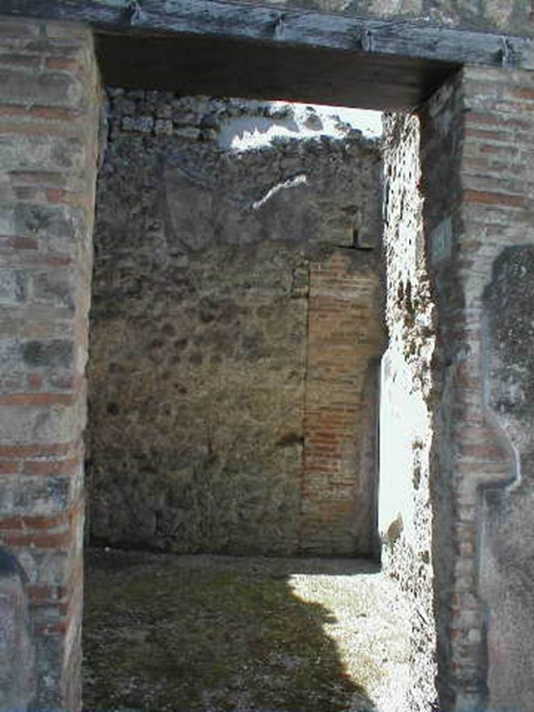 VI.14.29 Pompeii. May 2005. Looking west through entrance doorway.
According to Wallace-Hadrill, originally this would have been a room from VI.14.30 on the south side of the fauces. It had Style III decoration.
See Wallace-Hadrill, A. (1994): Houses and Society in Pompeii and Herculaneum. Princeton Univ. Press, (p. 213)
