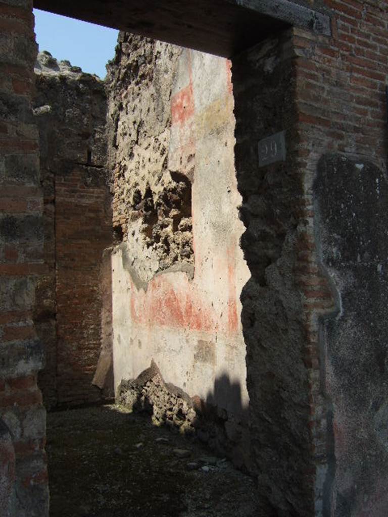 VI.14.29 Pompeii. May 2006. North wall. According to Della Corte, the room of the stairs at VI.14.29 which had originally been a cubiculum of the House of the Laocoonte, was decorated with Style III paintings. These have only been preserved in part on the north wall. In the centre of the north wall was found the picture of a man and a woman on a bed, in front of which is a table with drinks: a servant stands nearby. The painting is now in the Naples Archaeological Museum. Inventory number 111209. Sogliano described it (Sog.641 on p. 131). (Bull.Inst 1876, p.51, and Giorn.Scav.Pomp, n.s. III, p.147).
Another painting, Sogliano S.649, described a female figure lying on a bed. According to Sogliano this was found in the room to the left of the entrance of VI.14.28 (Bull.Inst 1876, p.51), but no decoration has survived. Della Corte thought it may have been from the corresponding room on the upper floor, as did Mau (B.I., 1876, p.49). This painting may have been in the cella meretricia, whose location was unknown.
See Della Corte, M., 1965. Case ed Abitanti di Pompei. Napoli: Fausto Fiorentino. (p.94) See Sogliano, A., 1879. Le pitture murali campane scoverte negli anni 1867-79. Napoli: (p. 131 and p. 133)