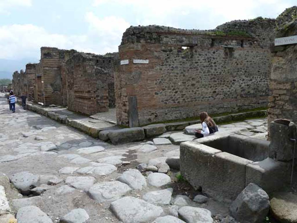 VI.14.31 Pompeii. May 2010. Looking south towards middle of Via Stabiana (Via del Vesuvio) with the north east corner of VI.14 on the right.