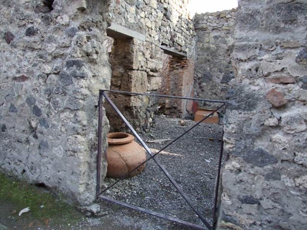 VI.14.35 Pompeii. December 2007. Looking south towards two doorways in east wall of caupona.