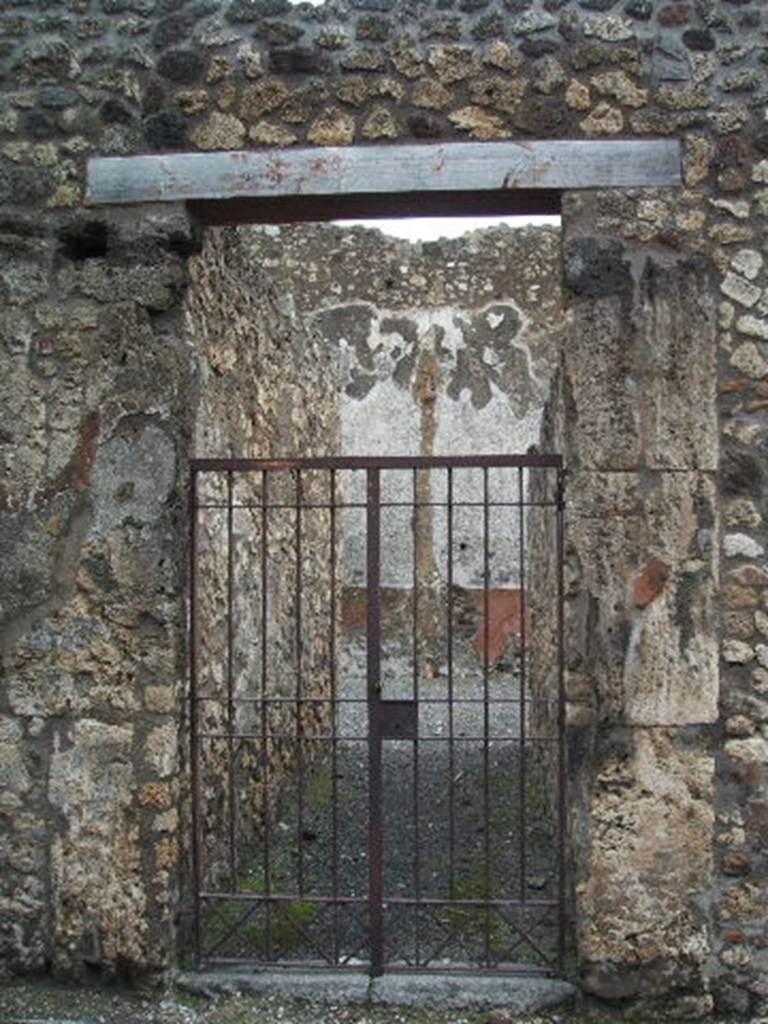 VI.14.37 Pompeii. December 2005. Entrance doorway. According to Della Corte, this was a modest house furnished with an upper floor, from which space for the Bar of Salvius had been taken originally. Probably the upper floor was used for living in, and the lower floor was occupied by the workshop. The paintings that adorned the right pilaster of the entrance, showed the industry that was carried on here. Mercury with purse and caduceus, and a carpenter sawing a beam with the help of a lad. On a seal/signet found here was �
       Potiti 
Popp. Sabini  
       (P.P.S)               [CIL X 8058, 71]
See Della Corte, M., 1965.  Case ed Abitanti di Pompei. Napoli: Fausto Fiorentino. (p.83, S.75)
According to Epigraphik-Datenbank Clauss/Slaby (See www.manfredclauss.de), this read �
Potiti 
Popp(aei) Sabini 
P(otiti) P(oppaei) S(abini)      [CIL X 8058, 71]
