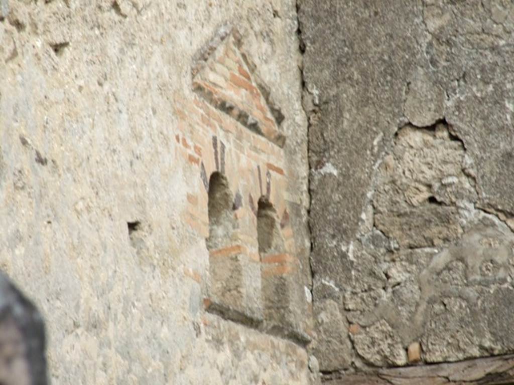 VI.14.40 Pompeii. December 2007. Double niche on north wall of atrium.
According to Boyce, at the extreme east end of the north wall of the atrium, are two vaulted niches, side by side. Above them both is a single pediment formed of projecting tiles. See Boyce G. K., 1937. Corpus of the Lararia of Pompeii. Rome: MAAR 14. (p. 54, no.207, with Pl.4,6)