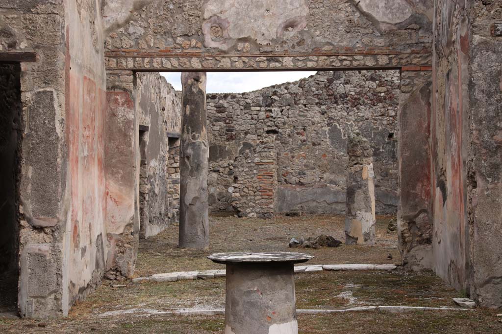 VI.14.40 Pompeii. October 2020. Looking east towards tablinum and peristyle. Photo courtesy of Klaus Heese.
According to Kuivalainen –
In the tablinum “The zoccolo/dado was black with floral motifs, the central zone was red with panels divided with bands, and between the fields were candelabra with twining plants. The upper zone had a white background.
On the upper north wall, but nearly destroyed, was a painted youth (a young, almost naked Bacchus) …… On the other walls Apollo and Ceres were painted.”
Description: A youth standing with his weight on his left foot, wearing yellow boots, a red cloak covering his back and forearms; a band from the right shoulder goes to the left hip. On his head is a vine wreath. In his right hand he holds a cantharus, in his left a thyrsus.
Comments: Young almost naked Bacchus. The band is rare, the boots or high footwear are more common.
See Kuivalainen, I., 2021. The Portrayal of Pompeian Bacchus. Commentationes Humanarum Litterarum 140. Helsinki: Finnish Society of Sciences and Letters, p.97, B5.