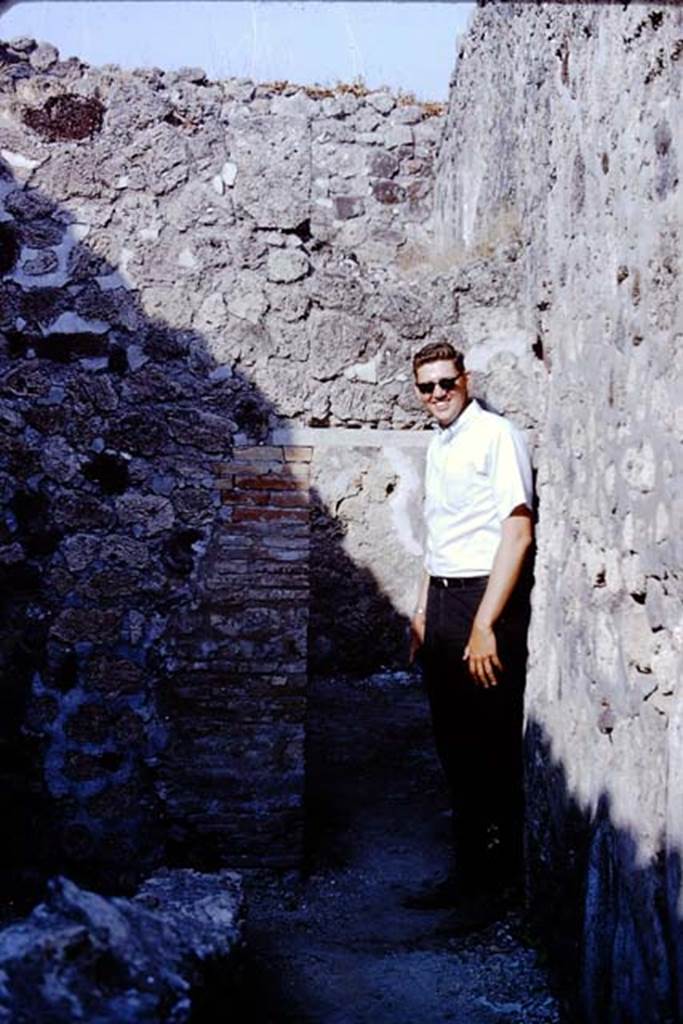 VI.14.41 Pompeii. 1966. Looking east to low doorway in corridor of workshop.
Photo by Stanley A. Jashemski.
Source: The Wilhelmina and Stanley A. Jashemski archive in the University of Maryland Library, Special Collections (See collection page) and made available under the Creative Commons Attribution-Non Commercial License v.4. See Licence and use details. J66f0249