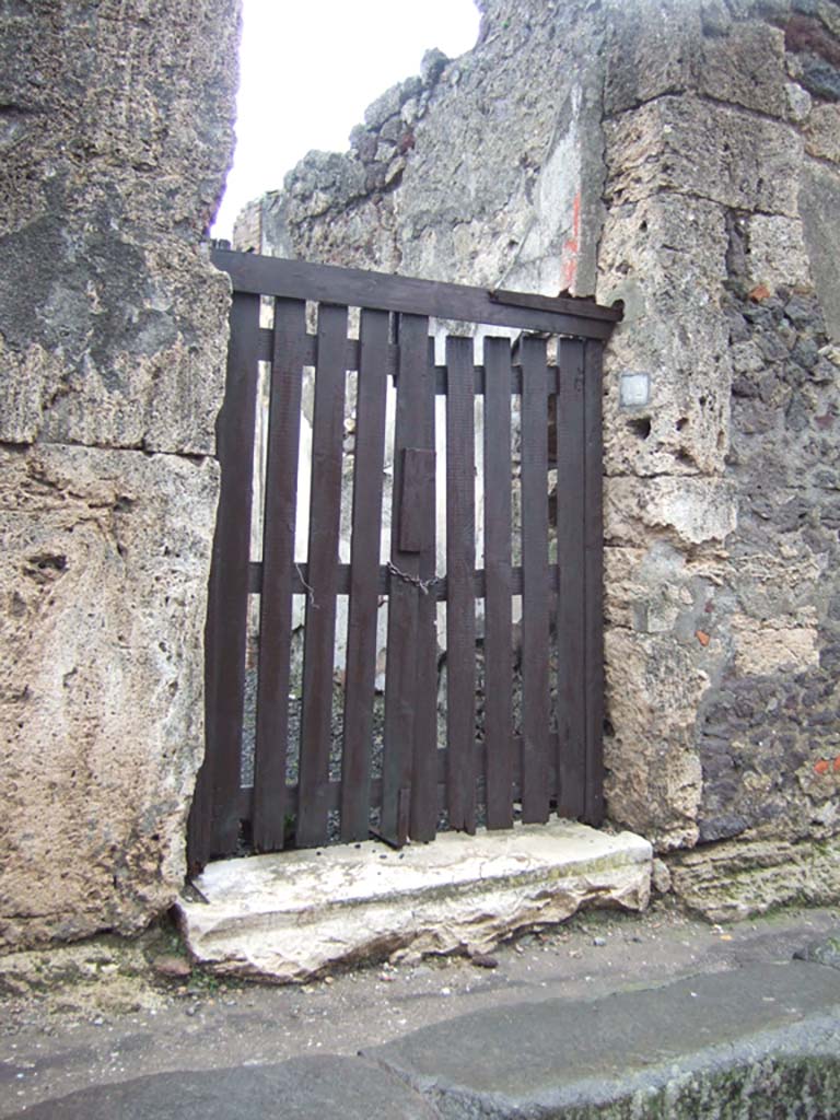 VI.14.42 Pompeii. December 2005. Entrance doorway.
According to Breton, this dwelling discovered in 1846 in the presence of the princess that gave it her name.
In it were found a large quantity of statues, utensils, coins and precious objects.
Today, it is very ruined and offers nothing remarkable.
See Breton, Ernest. 1870. Pompeia, Guide de visite a Pompei, 3rd ed. Paris, Guerin. 

Graffito found outside the doorway in February 1846 was �
Pompeium  o)(ro)  v(os)  f(aciatis)
Inventus  rog(at)      [CIL IV 327}
See Pagano, M. and Prisciandaro, R., 2006. Studio sulle provenienze degli oggetti rinvenuti negli scavi borbonici del regno di Napoli. Naples: Nicola Longobardi, (p. 161). PAH II, 449.

According to Della Corte, this house, spacious and simply decorated, may have been the house of Inventus, because of an electoral recommendation found to the right of the entrance, in support of a specially favoured candidate, perhaps a neighbour, Sesto Pompeio.
Inventus rog(at)     [CIL IV 327]
See Della Corte, M., 1965. Case ed Abitanti di Pompei. Napoli: Fausto Fiorentino. (p.86)
