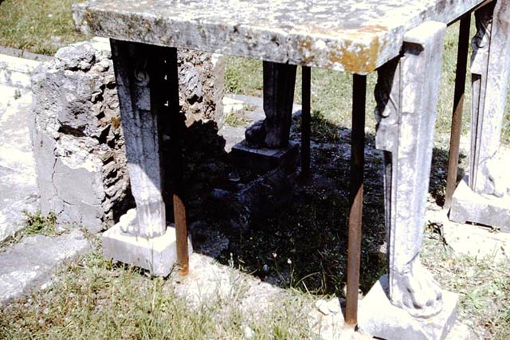 VI.14.43 Pompeii. 1964.  Room 1, remains of lead pipe and valve behind impluvium in atrium.
Photo by Stanley A. Jashemski.
Source: The Wilhelmina and Stanley A. Jashemski archive in the University of Maryland Library, Special Collections (See collection page) and made available under the Creative Commons Attribution-Non Commercial License v.4. See Licence and use details.
J64f1615
