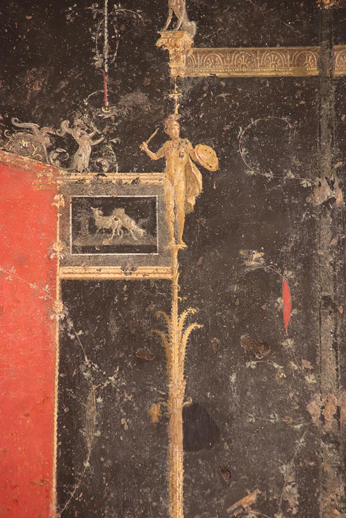 VI.15.1 Pompeii. October 2024.
Detail from top of candelabra from left side of panel at west end of north wall. Photo courtesy of Klaus Heese.