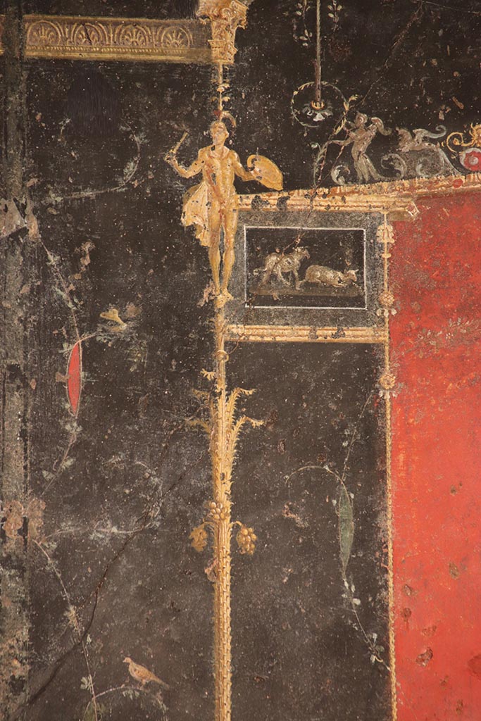 VI.15.1 Pompeii. October 2024.
Detail from top of candelabra from right side of panel at west end of north wall. Photo courtesy of Klaus Heese.
