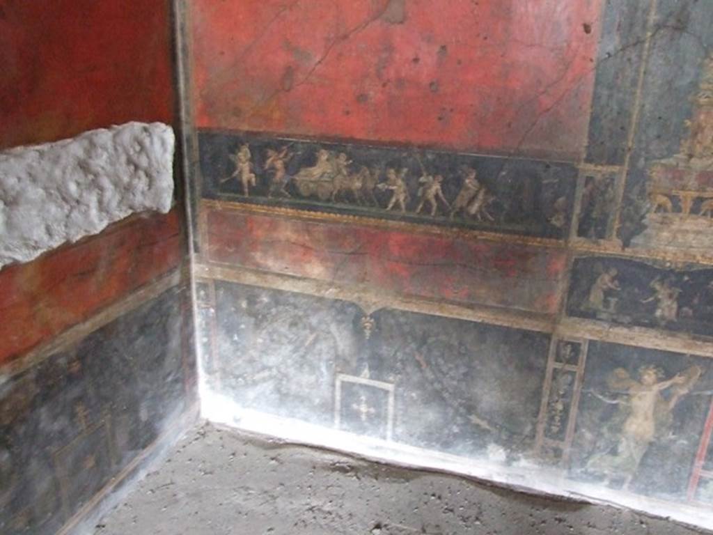 VI.15.1 Pompeii. December 2006.
Lower north wall in north-west corner with painting of cupids celebrating a festival in honour of Bacchus
Underneath right is a standing female figure of a Bacchante.