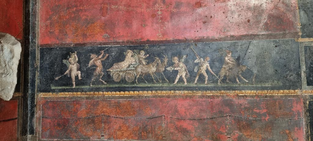 VI.15.1 Pompeii. January 2023.
North wall in north-west corner with painting of cupids celebrating a festival in honour of Bacchus. Photo courtesy of Miriam Colomer.