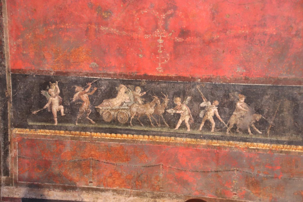 VI.15.1 Pompeii. October 2023.
North wall in north-west corner with painting of cupids celebrating a festival in honour of Bacchus. Photo courtesy of Klaus Heese.