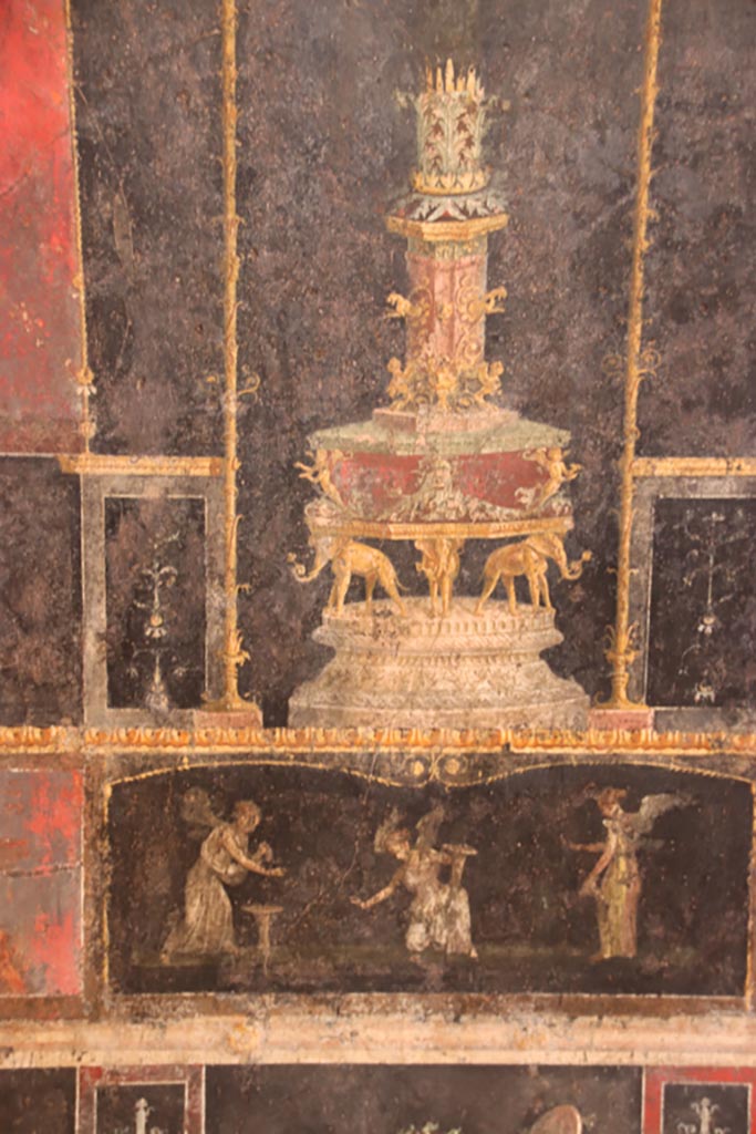 VI.15.1 Pompeii. October 2023.
North wall, small panel in predella showing three Psychai gathering flowers. Photo courtesy of Klaus Heese.