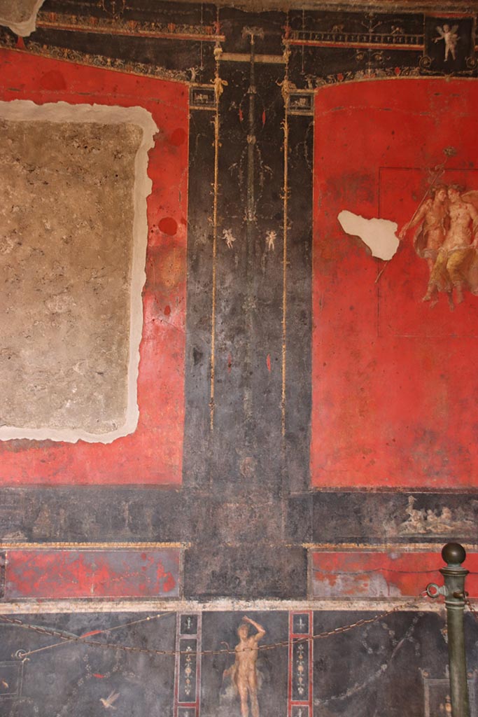 VI.15.1 Pompeii. October 2024.
Black painted panel with candelabra from east end of north wall. Photo courtesy of Klaus Heese.
