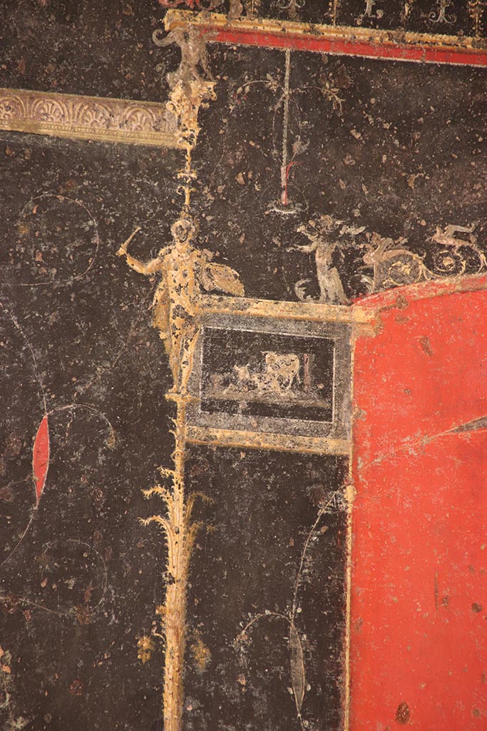 VI.15.1 Pompeii. October 2024.
Detail from top of right side of black painted panel with candelabra from east end of north wall.
Photo courtesy of Klaus Heese.