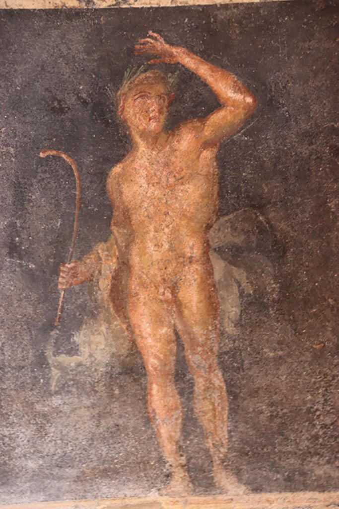 VI.15.1 Pompeii. October 2023.
Zoccolo on east side of central panel, painting of Satyr. Photo courtesy of Klaus Heese.