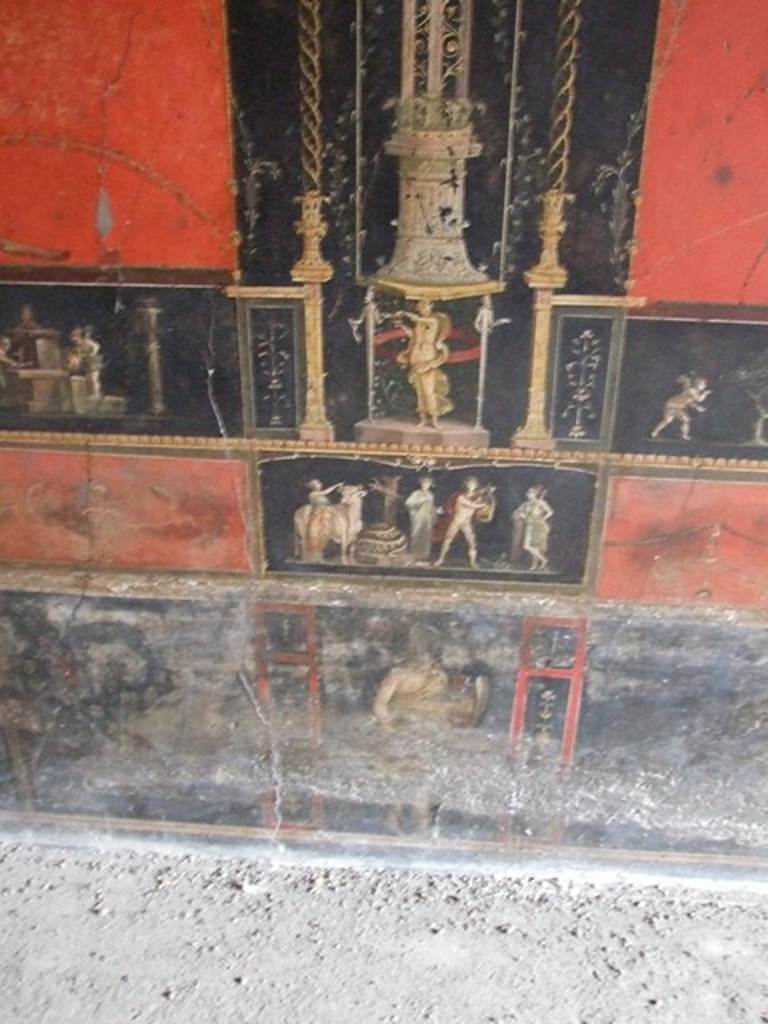VI.15.1 Pompeii. December 2006. Room of the Cupids or Cherubs. East wall with painting of Apollo and Diana after the killing of the python. Underneath is a standing figure of an Amazon armed with shield.