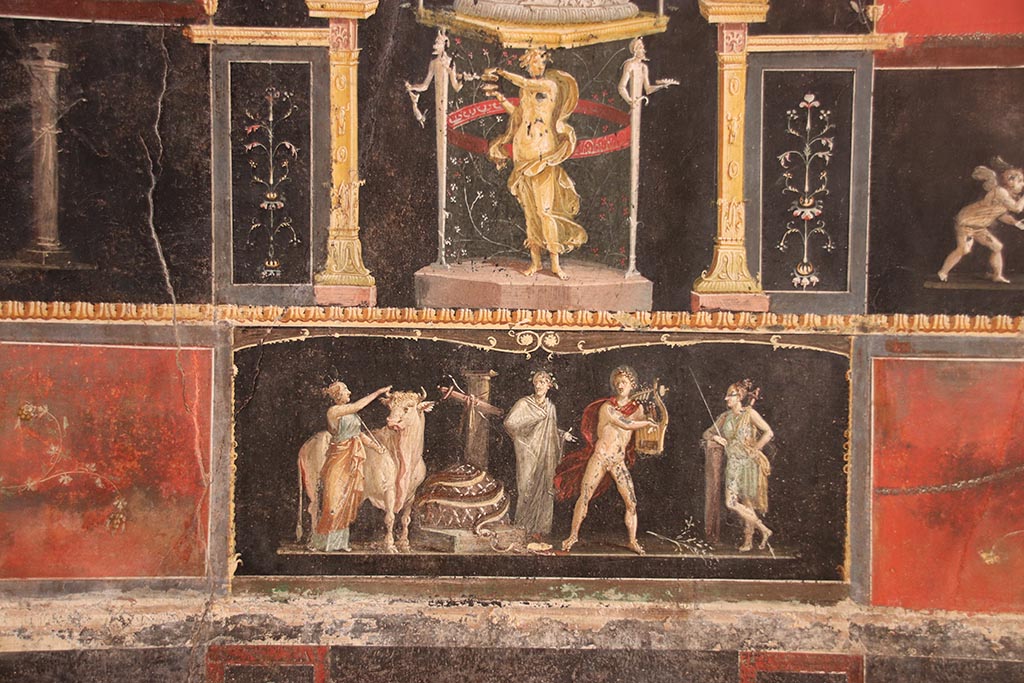 VI.15.1 Pompeii. October 2024.
East wall with detail of painting of Apollo and Diana after the killing of the python. Photo courtesy of Klaus Heese.