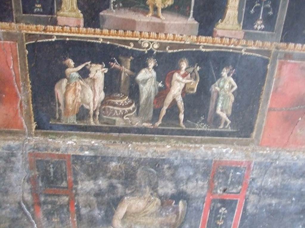 VI.15.1 Pompeii. December 2006. Room of the Cupids or Cherubs. East wall. Detail of painting of Apollo and Diana after the killing of the python. Underneath is a standing figure of an Amazon armed with a shield.