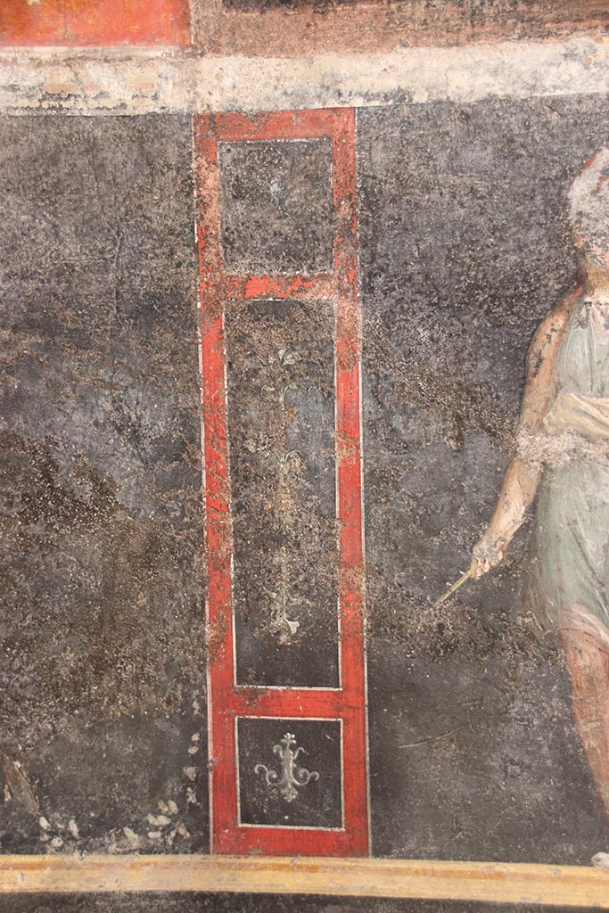 VI.15.1 Pompeii. October 2024.
Detail from lower east wall on north side of panel with painted Amazon. Photo courtesy of Klaus Heese.