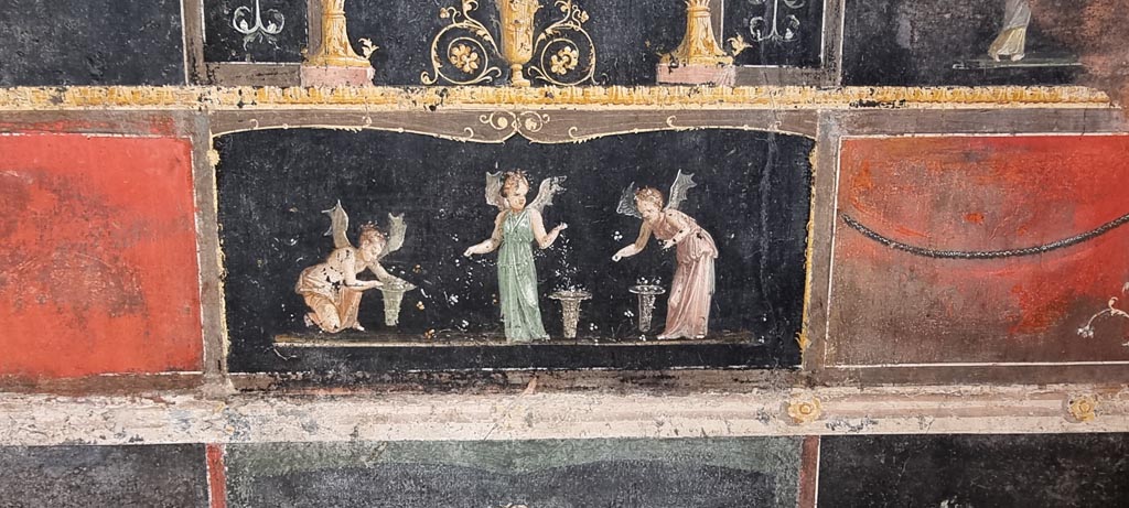 VI.15.1 Pompeii. January 2023.
East wall with painting of Psychai (female cupids) gathering petals. Photo courtesy of Miriam Colomer.