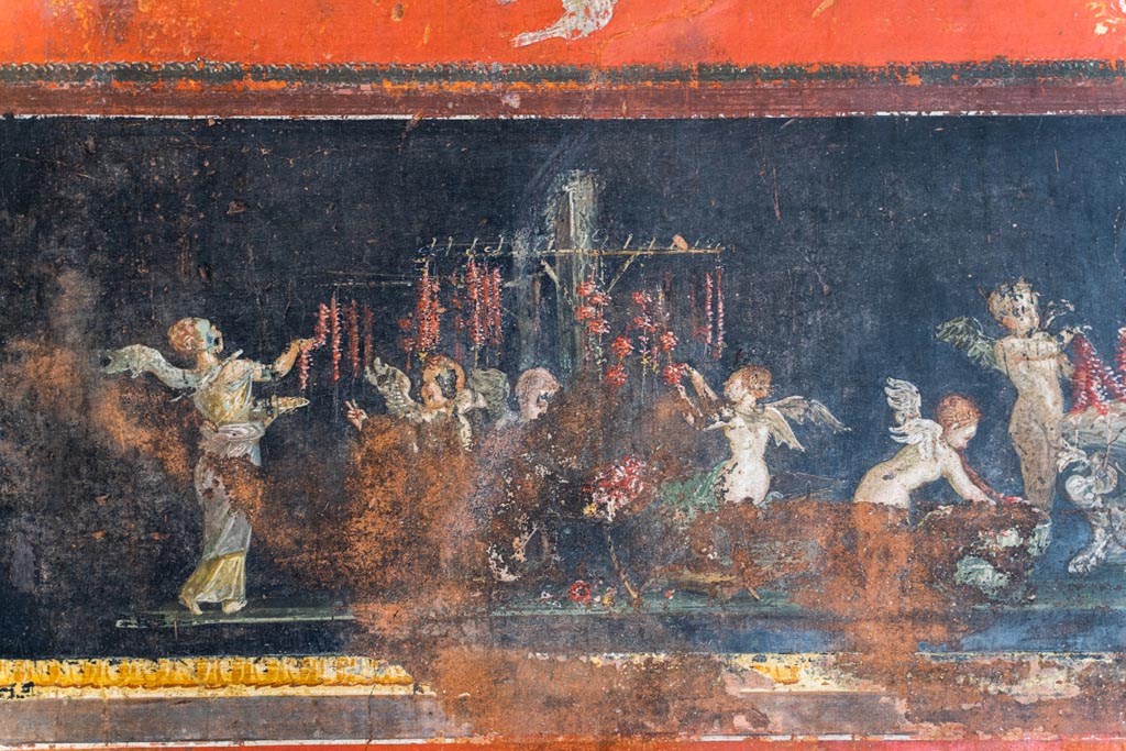 VI.15.1 Pompeii. March 2023.
East wall in the south-east corner part of painted panel of cupids as flower dealers, picking and selling flowers and making garlands.
Photo courtesy of Johannes Eber.