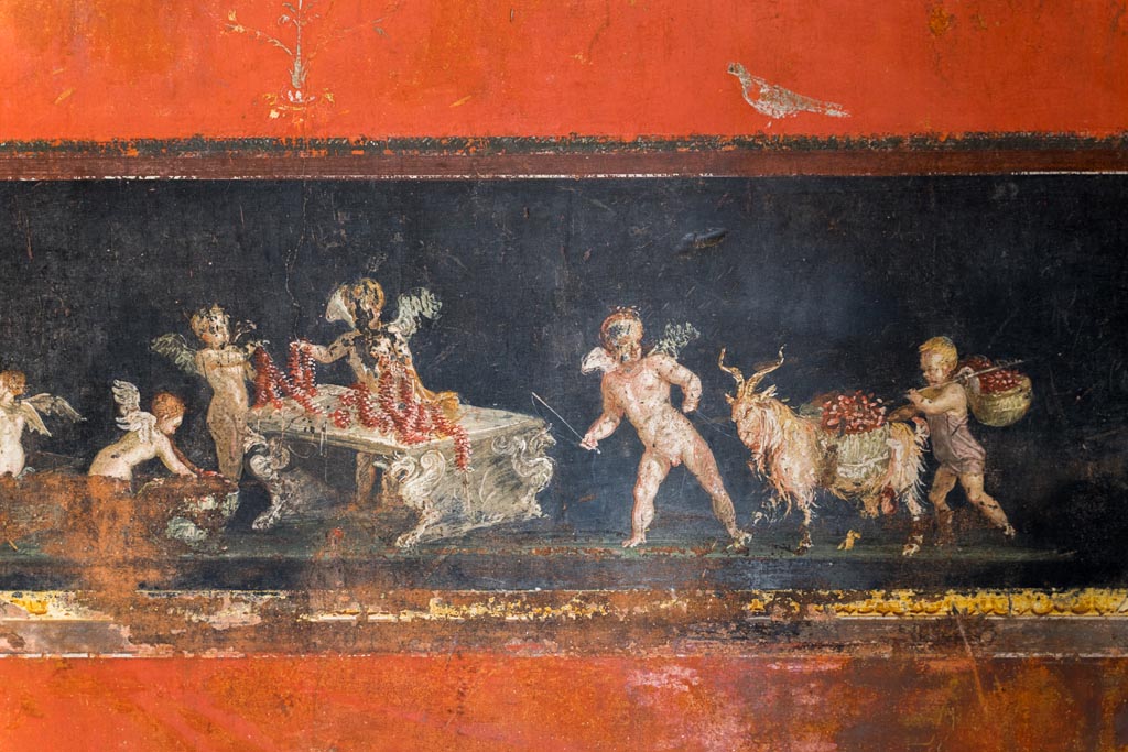 VI.15.1 Pompeii. March 2023.
East wall in the south-east corner part of painted panel of cupids as flower dealers, picking and selling flowers and making garlands.
Photo courtesy of Johannes Eber.