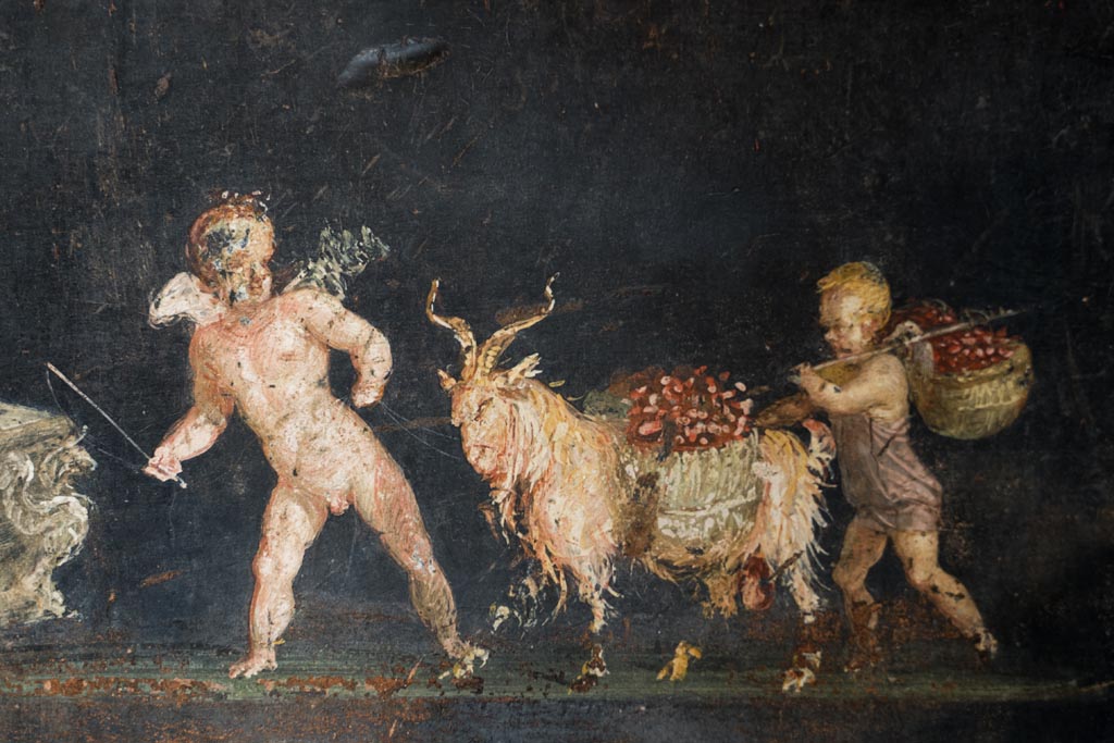VI.15.1 Pompeii. March 2023.
East wall in the south-east corner, detail of part of painted panel of cupids as flower dealers, picking and selling flowers and making garlands.
Photo courtesy of Johannes Eber.