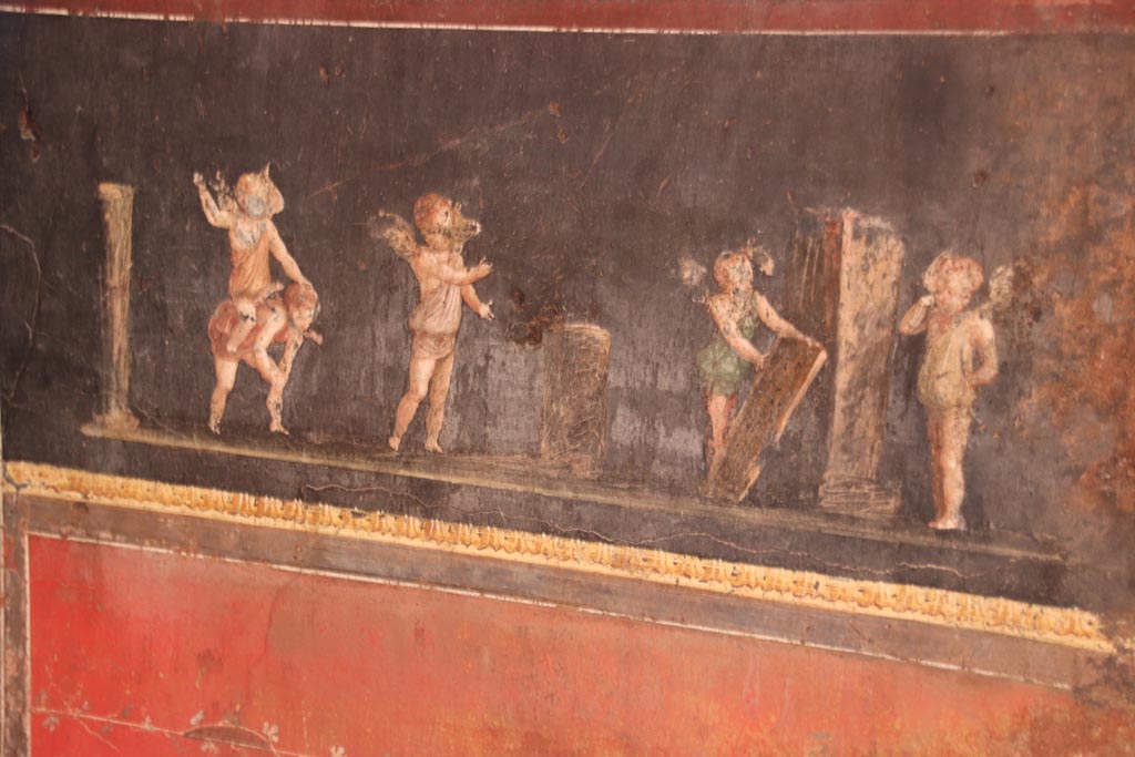 VI.15.1 Pompeii. October 2023. Detail of cupids from south wall in south-east corner. Photo courtesy of Klaus Heese.